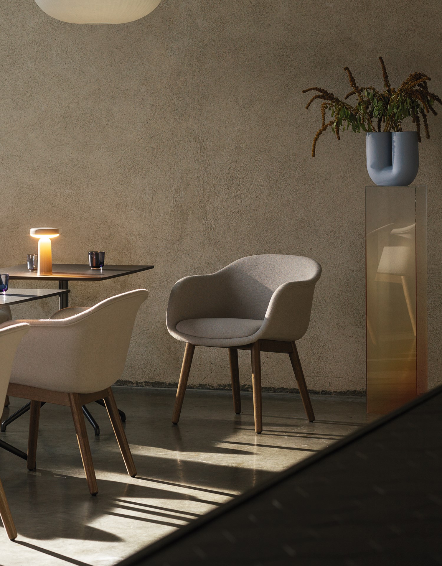 Fiber Conference in Hallingdal 113 & Stained Dark Brown - Still Café Table 75x65 in Black - Ease Portable Lamp in Taupe - Strand Closed Ø60 - Raise Glasses in Dark Blue - Kink Vase in Light Blue  Fiber Conference in Hallingdal 113 & Stained Dark Brown - Still Café Table 75x65 in Black - Ease Portable Lamp in Taupe - Strand Closed Ø60 - Raise Glasses in Dark Blue - Kink Vase in Light Blue