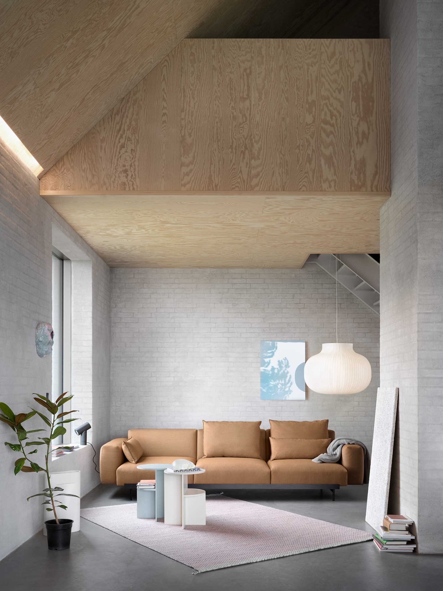 In Situ 3-seater sofa upholstered in Fiord 451 fabric, shown in a contemporary setting with Ply rug in rose and Halves side table in sage green and beige. Scandinavian minimalist design by Muuto In Situ 3-seater sofa upholstered in Fiord 451 fabric, shown in a contemporary setting with Ply rug in rose and Halves side table in sage green and beige. Scandinavian minimalist design by Muuto
