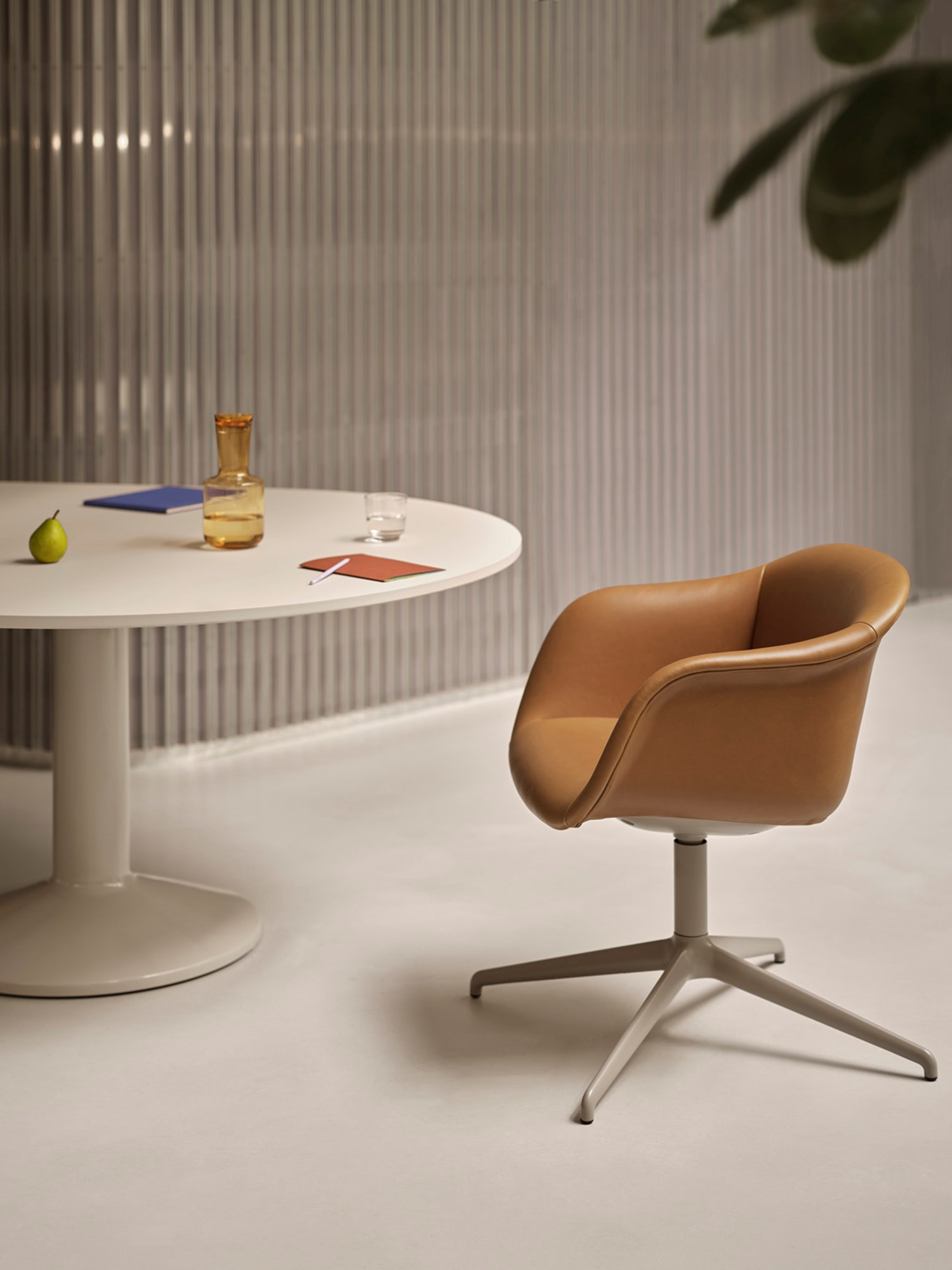 Refined cognac leather Fiber soft Armchair on a chrome swivel base, paired with a grey Midst conference table with power. Ideal for professional or meeting spaces. Refined cognac leather Fiber soft Armchair on a chrome swivel base, paired with a grey Midst conference table with power. Ideal for professional or meeting spaces.