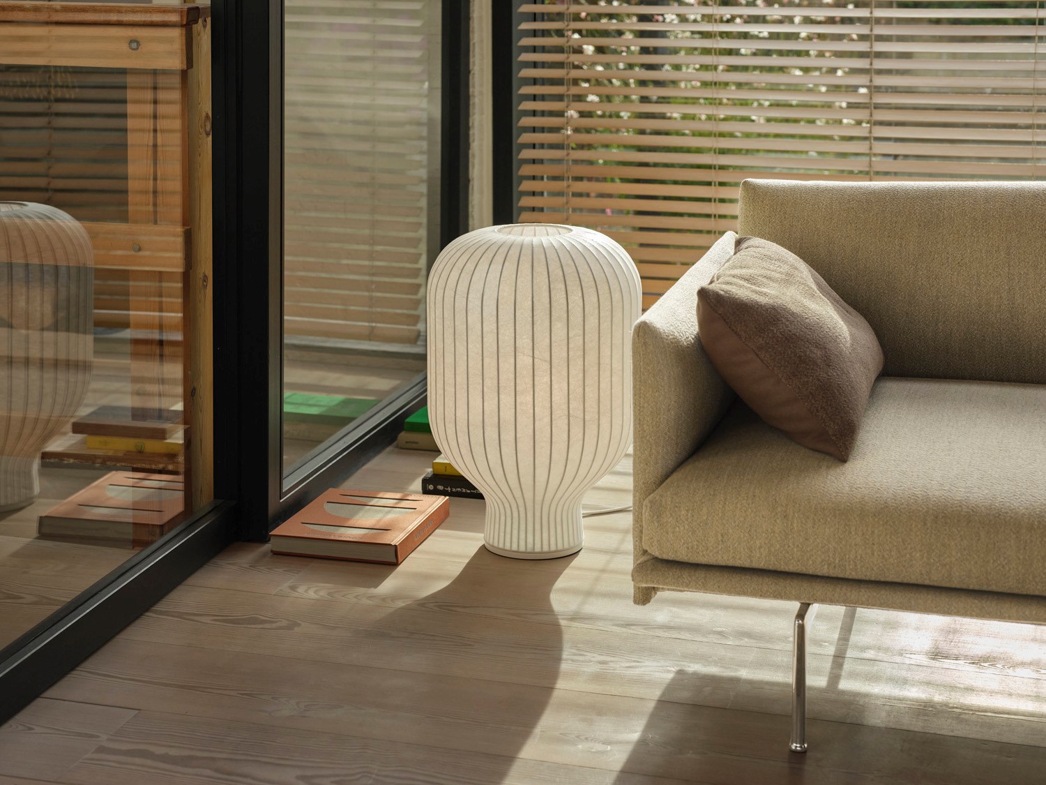 The sculptural form with soft curves understates the feeling of a pleasant light. The Strand Table Lamp H59 size is in between a floor and table lamp, which ensure a very versatile use for several different contexts.  The sculptural form with soft curves understates the feeling of a pleasant light. The Strand Table Lamp H59 size is in between a floor and table lamp, which ensure a very versatile use for several different contexts.