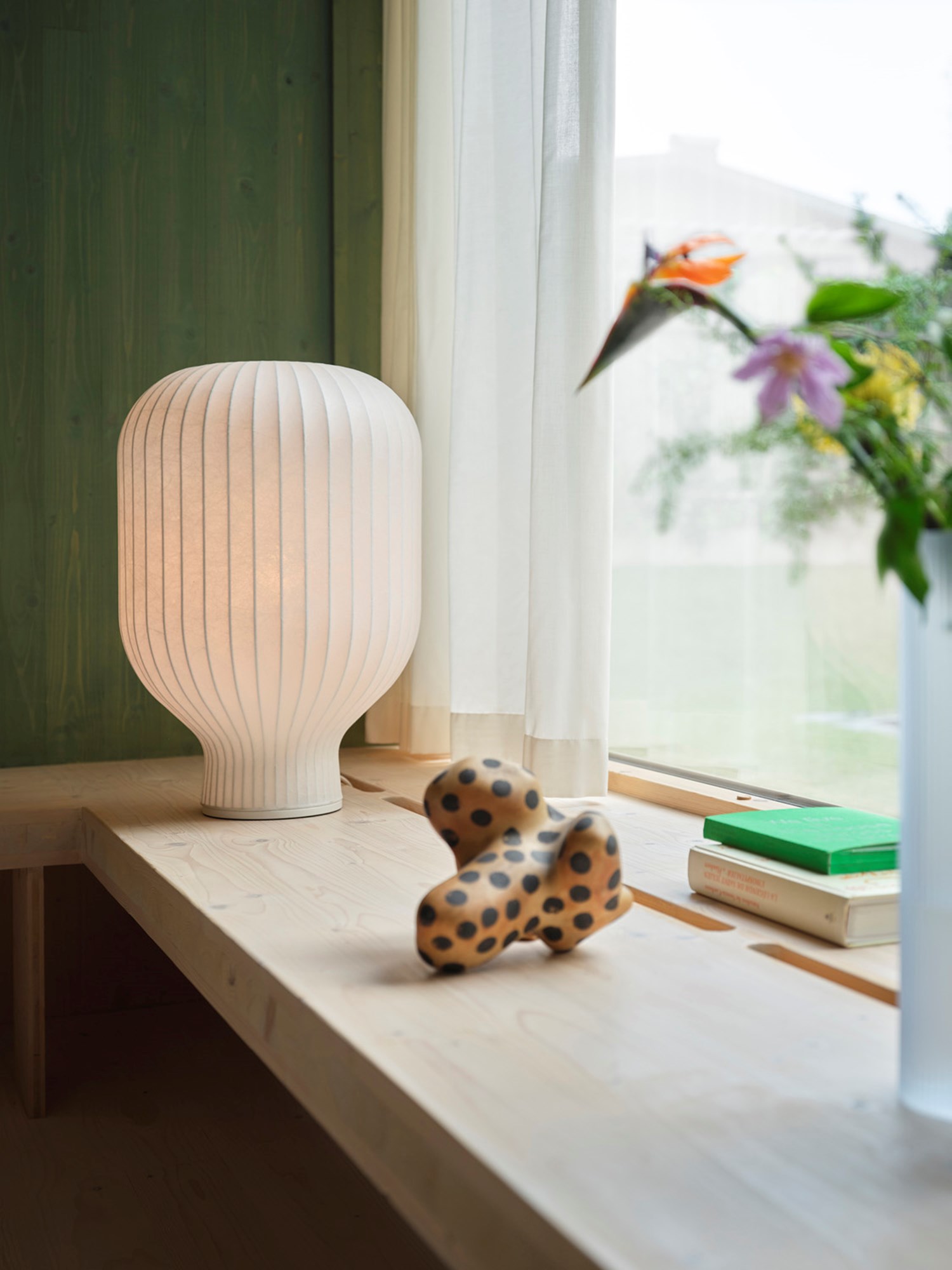 The sculptural form with soft curves understates the feeling of a pleasant light. The Strand Table Lamp H59 size is in between a floor and table lamp, which ensure a very versatile use for several different contexts.  The sculptural form with soft curves understates the feeling of a pleasant light. The Strand Table Lamp H59 size is in between a floor and table lamp, which ensure a very versatile use for several different contexts.